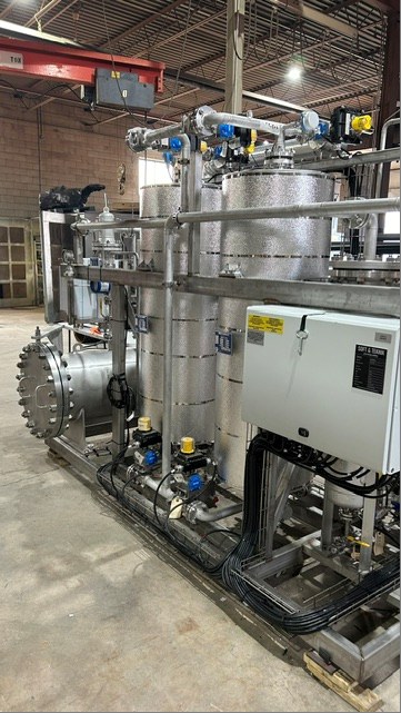 Side view of an Infiltek gas filtration skid showing piping, actuated valves and control panel